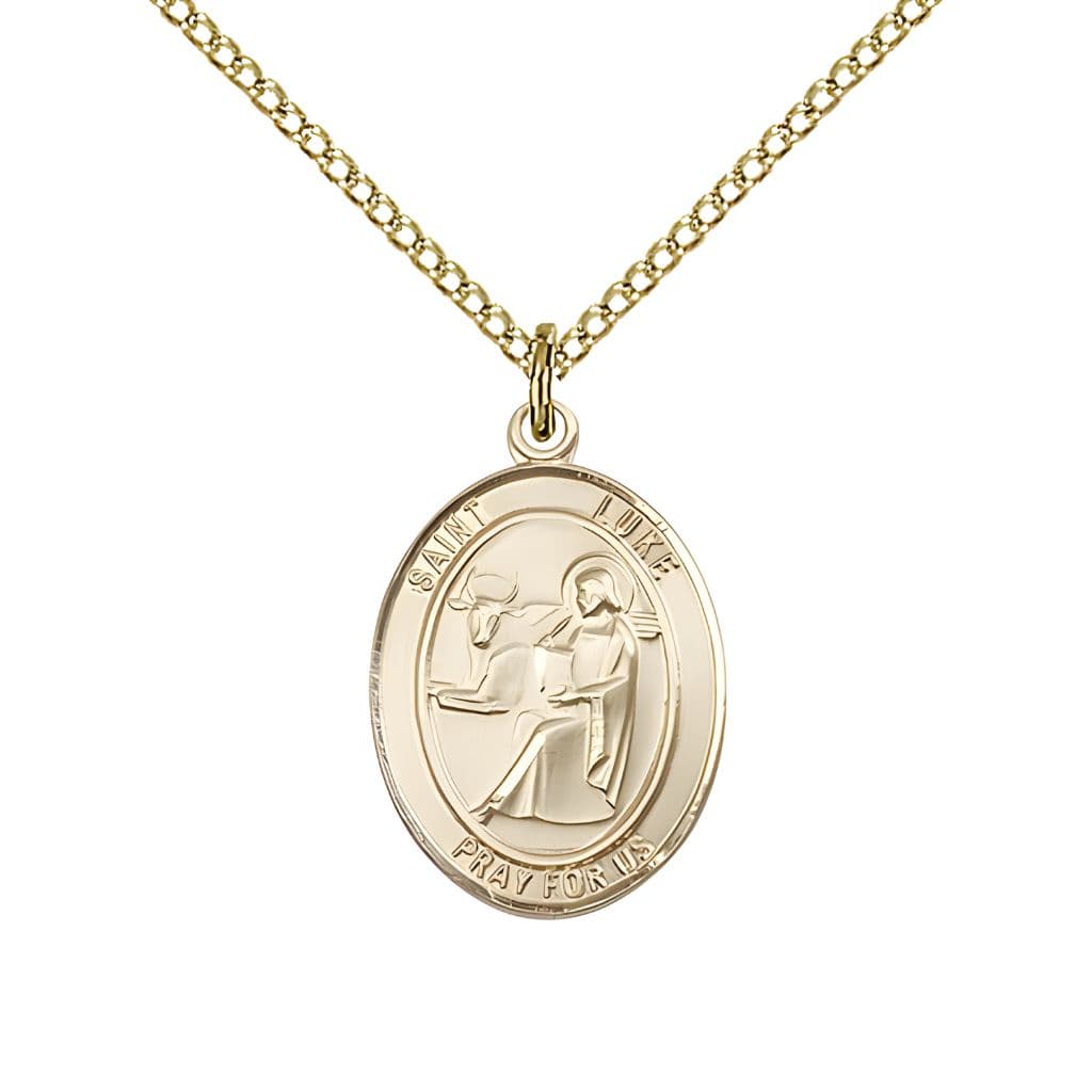 Bliss St. Luke the Apostle 14kt Gold Oval Medal Pendant with 14kt Gold Chain, Measures 3/4-inch tall by 1/2-inch wide.