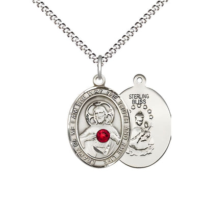 Red Crystal Sacred Heart of Jesus Scapular Sterling Silver Oval Medal Pendant with Rhodium-plated Chain, Measures 3/4-inch tall by 1/2-inch wide. Deluxe Gift Box, Bliss Manufacturing