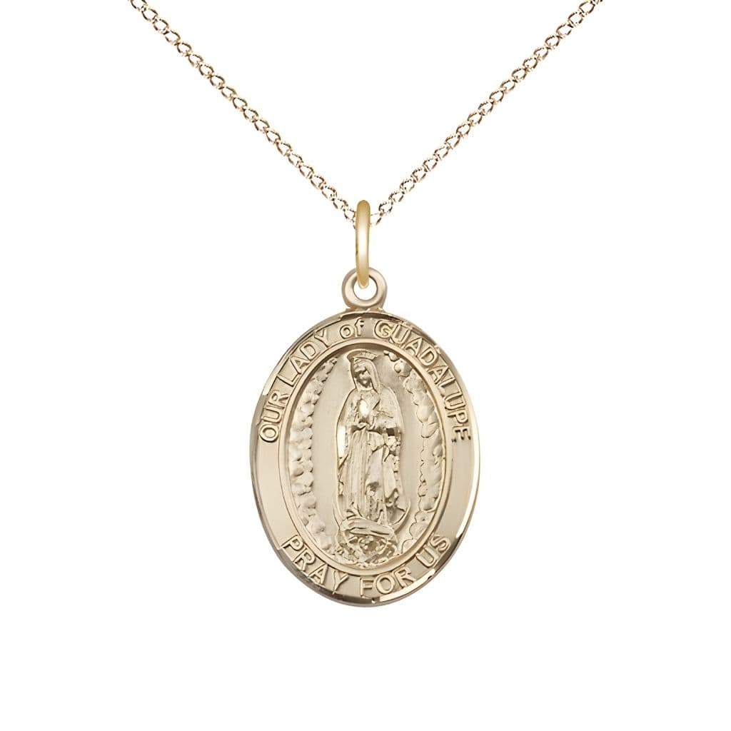 Bliss Our Lady of Guadalupe 14kt Gold Oval Medal Pendant with 14kt Gold Chain, Measures 3/4-inch tall by 1/2-inch wide.
