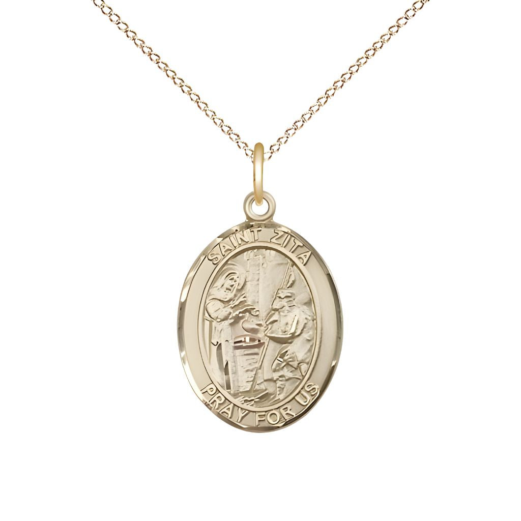 Bliss St. Zita 14kt Gold Oval Medal Pendant with 14kt Gold Curb Chain, Measures 3/4-inch tall by 1/2-inch wide.