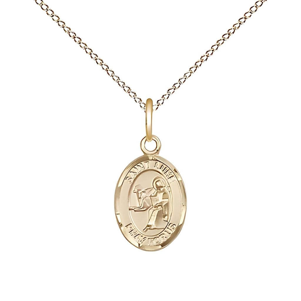 Bliss St. Luke the Apostle 14kt Gold-filled Oval Small Children Medal with Gold-filled Chain, Measures 1/2-inch tall by 1/4-inch wide.