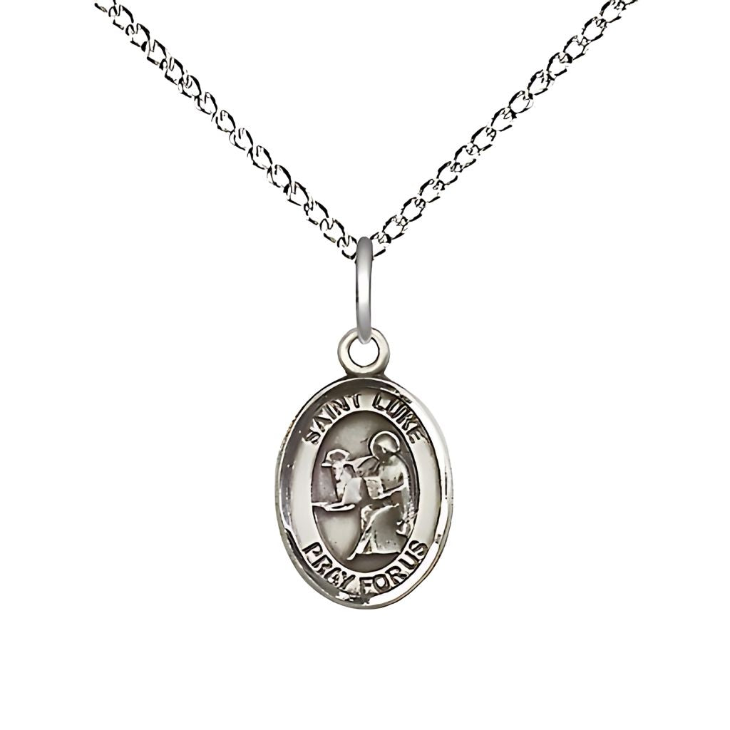 Bliss St. Luke the Apostle Engravable Small Children Sterling Silver Medal with Sterling Chain, Measures 1/2-inch tall by 1/4-inch wide.