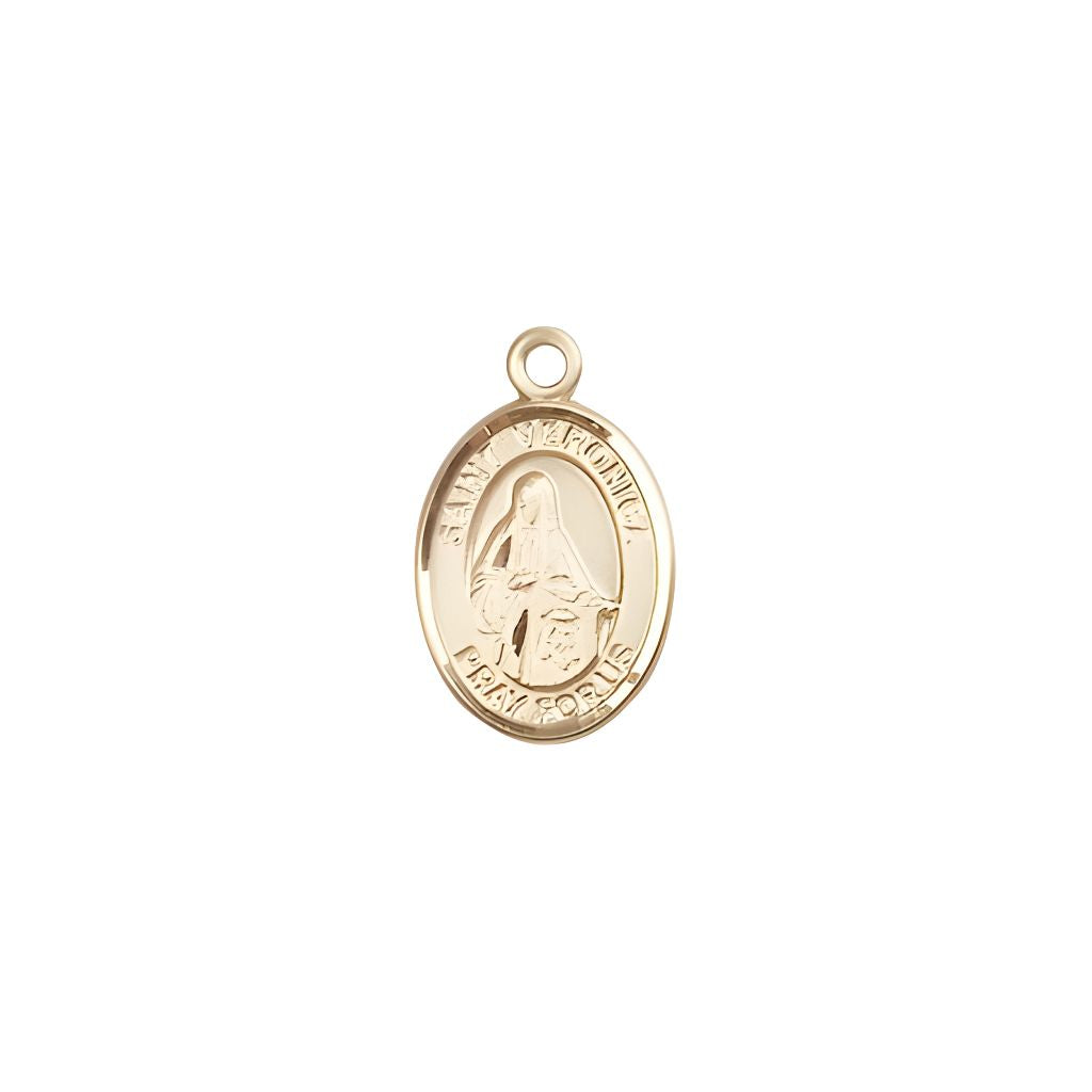 Bliss St. Veronica 14kt Gold Oval Small Children Medal, Measures 1/2-inch tall by 1/4-inch wide.
