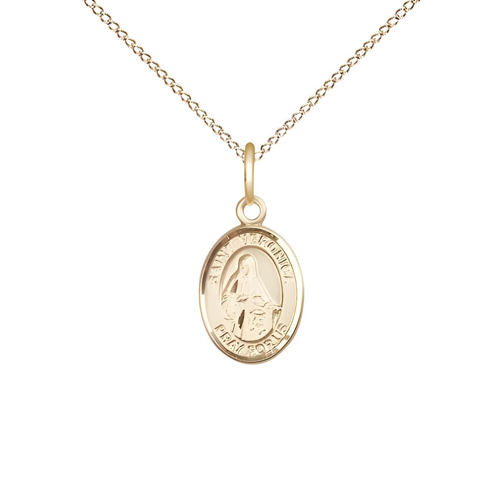 Bliss St. Veronica 14kt Gold Oval Small Children Medal with 14kt Gold Chain, Measures 1/2-inch tall by 1/4-inch wide.