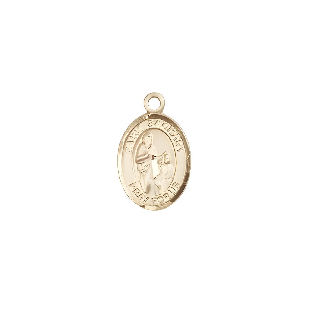 St. Zachary 14kt Gold Oval Small Children Medal by Bliss, Measures 1/2-inch tall by 1/4-inch wide.