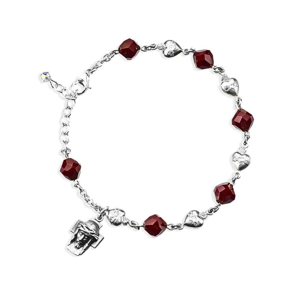 Sacred Heart Bead Sterling Silver Rosary Bracelet features 8mm red coral faceted crystal beads and Sterling Silver Sacred Heart beads with a Christ medal
