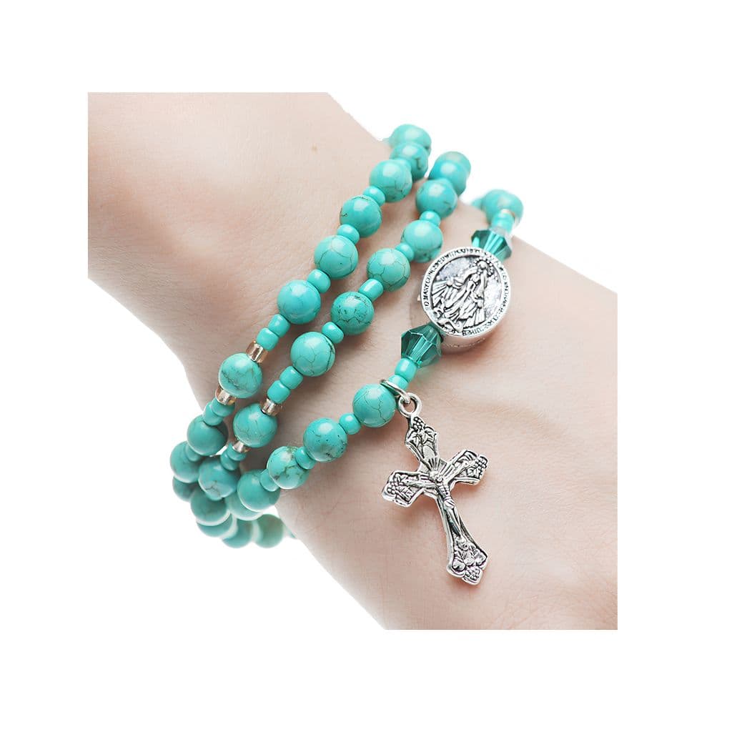 McVan Turquoise Twistable Full Rosary Bracelet — 6mm simulated turquoise jasper beads form a full rosary shown on arm.
