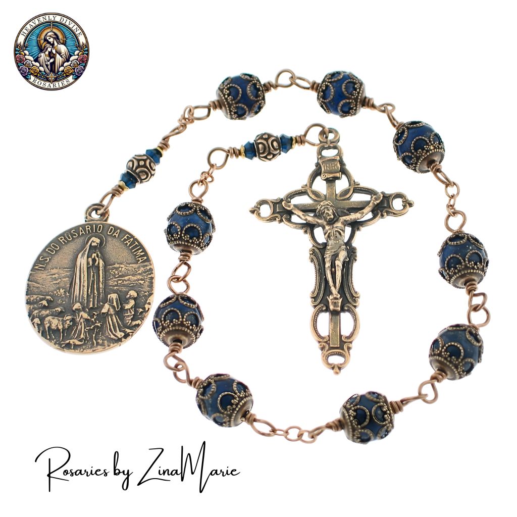 Handmade Our Lady of Fatima 9 Bead Prayer Chaplet by Zina Marie, 8mm Blue Lapis Lazuli and blue denim Austrian crystal beads. Replica medal 1 1/4" with a 2 1/4" crucifix featuring openwork design.