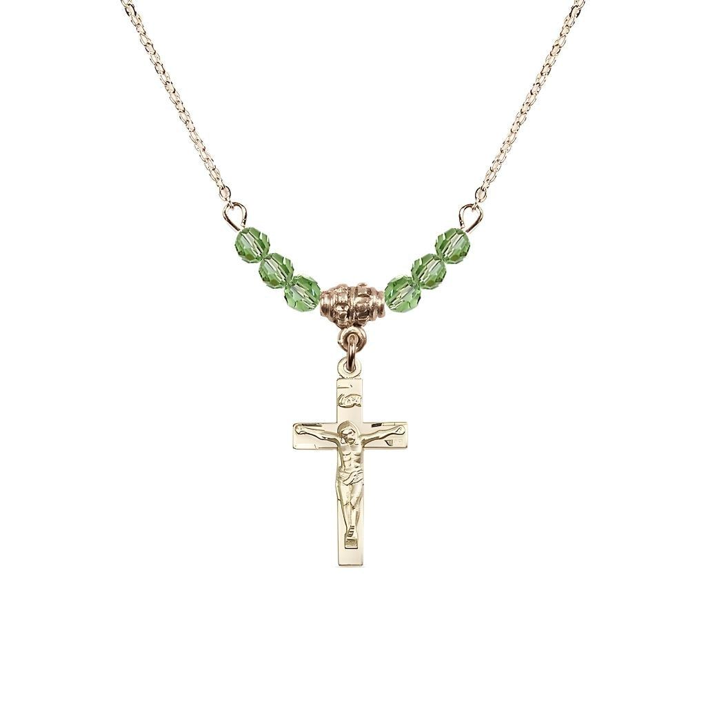 Bliss Gold-plated Holy Communion Crucifix Peridot Beaded Necklace, Measures 1/2-inch tall by 3/8-inch wide