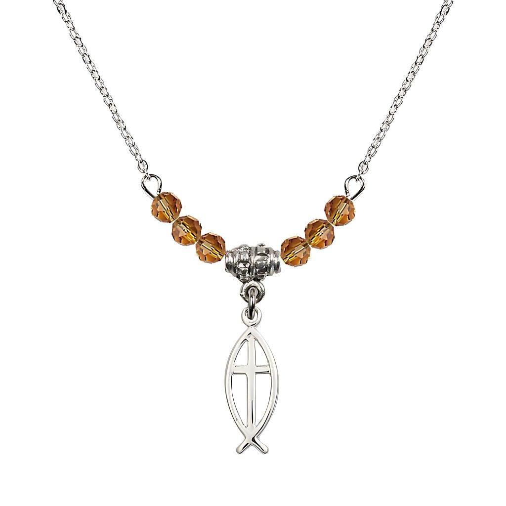 Bliss Fish Cross Crystal Birthstone Necklace with Chain in Topaz, 3/4 inch tall by 1/4 inch wide