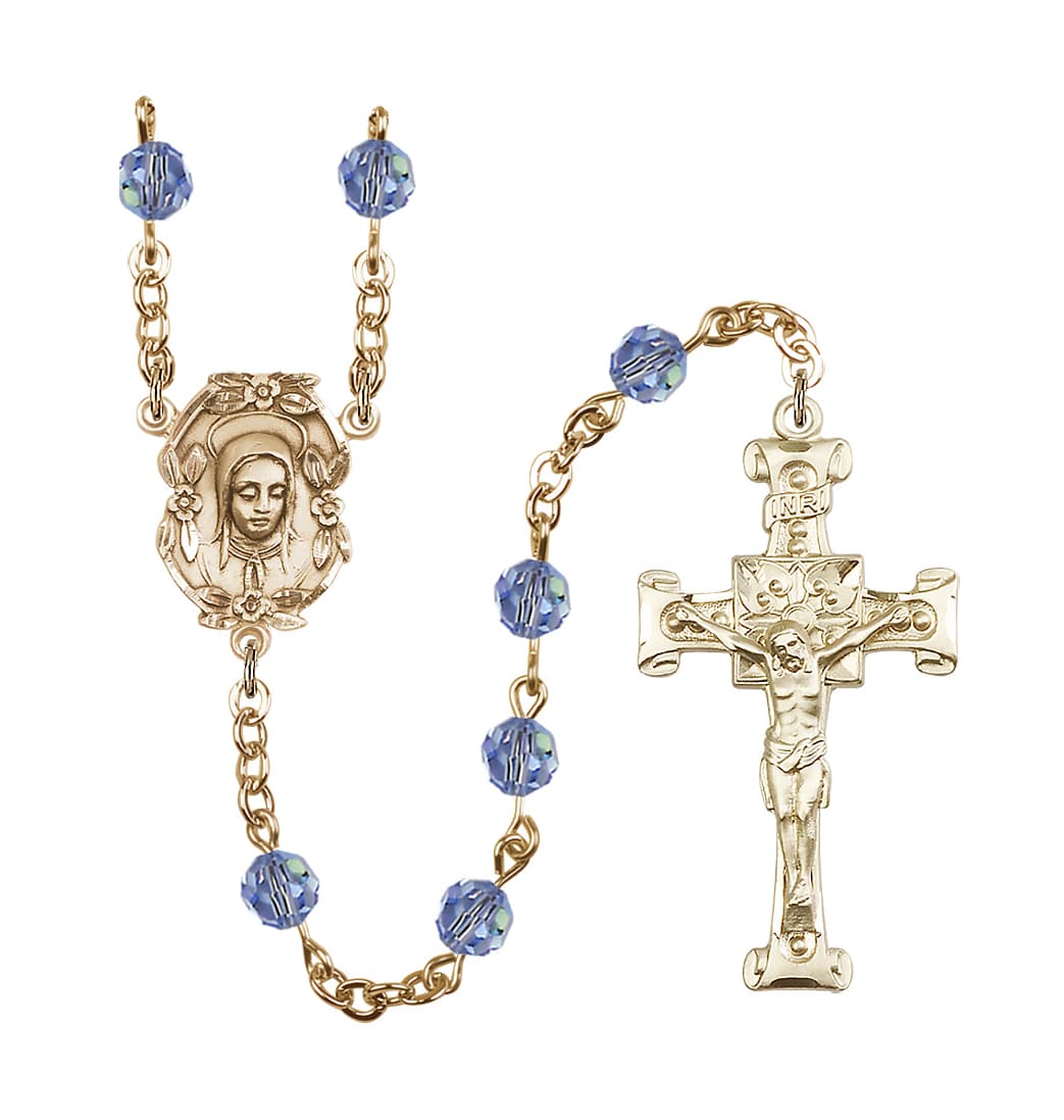 Bliss Handmade Gold-plated Rosary with Madonna Centerpiece, Scroll Design Crucifix and Light Sapphire 6mm Round Austrian Crystal beads.