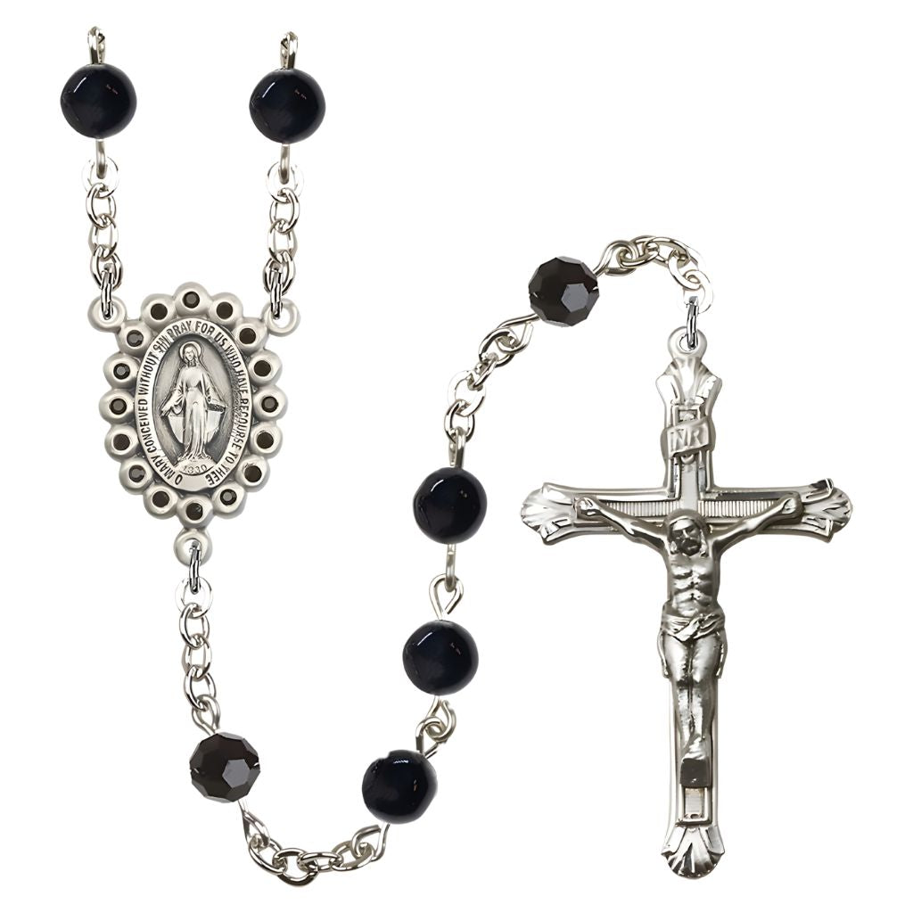 Bliss Man's Rosary features 6mm Black Onyx beads with Jet Austrian Crystal Our Father Beads with Silver Plate Miraculous Centers surrounded by 16 Black or Crystal Austrian Crystal Stones measure 1-inch by 5/8-inch.