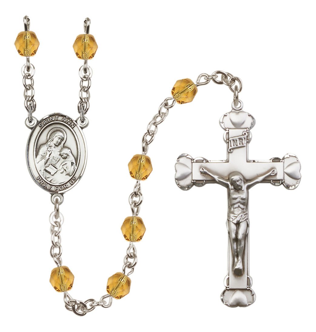 Bliss Manufacturing Silver Plated 6mm Fire Polished Saint Ann Rosary in Topaz,