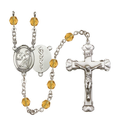 St Luke Doctor Birthstone Crystal Heart Tip Rosary in Topaz/Nov, Bliss Manufacturing