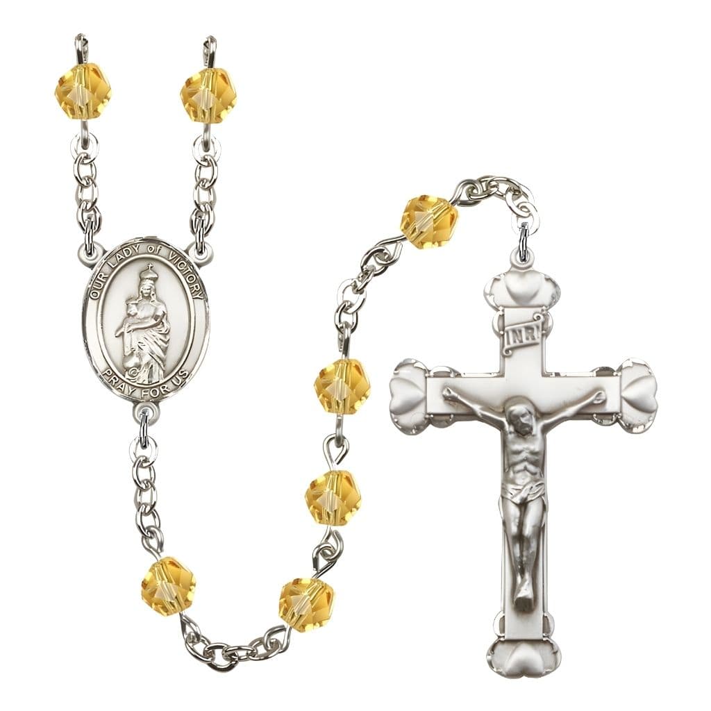 Bliss Our Lady of Victory November Birthstone Topaz  6mm Fire Polished Silver-plated Engravable Heart Tip Rosary with Pewter Centerpiece and Crucifix