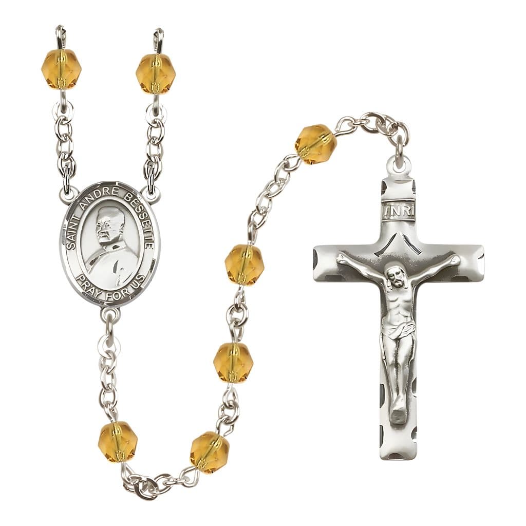 Bliss St. Andre Bessette Engravable Rosary with Pewter Crucifix and Centerpiece, Birthstone 6mm Fire Polished Topaz Beads for November