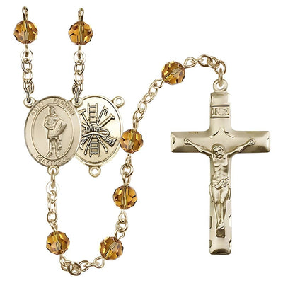 St. Florian centerpiece with firefighter gear on back Birthstone 14kt Gold Rosary with topaz 6mm Austrian crystal beads with a traditional crucifix, Bliss Manufacturing