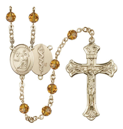 Doctor St Luke 14kt Gold Flared Tip Crucifix Crystal Rosary in Topaz/Nov, Bliss Manufacturing