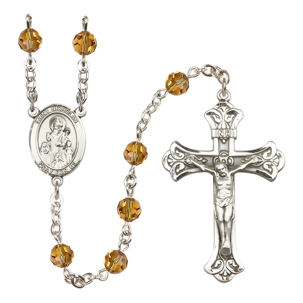 Bliss St. Nicholas Engravable Rosary with Sterling Silver Centerpiece and Scroll Design Crucifix, November Birthstone 6mm Topaz Austrian Crystal Beads