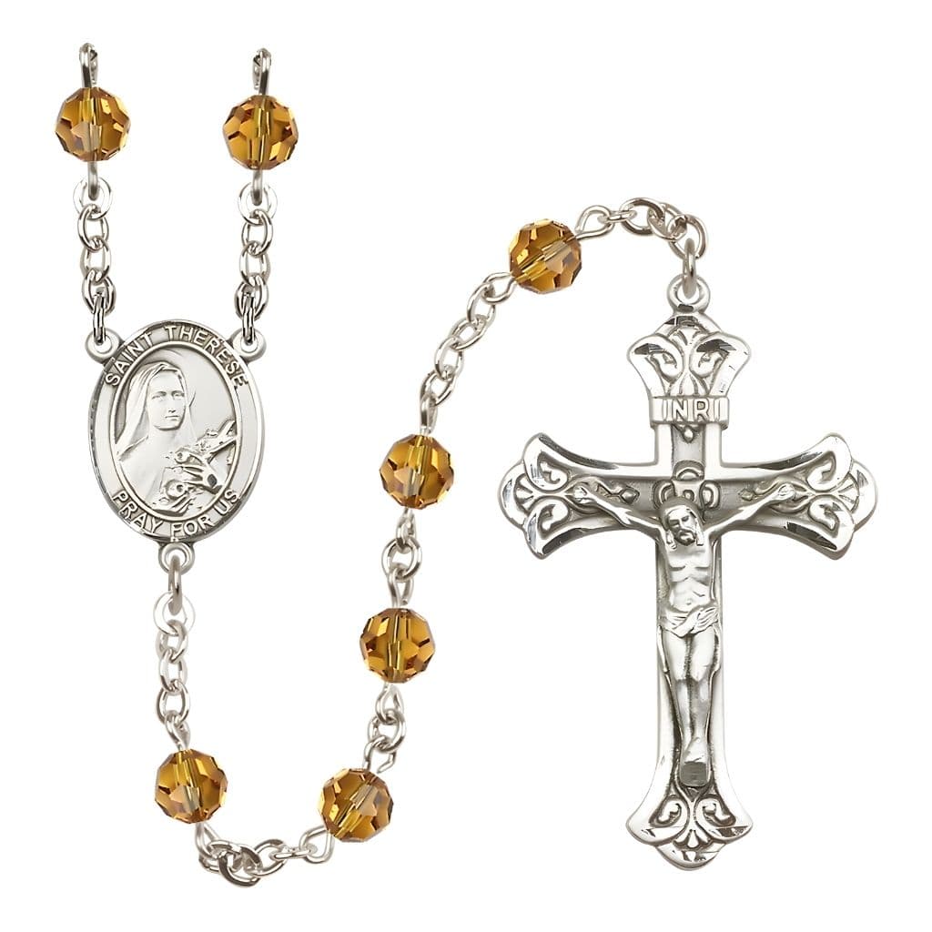 Bliss St. Therese of Lisieux Engravable Rosary with Sterling Silver Centerpiece and Scroll Design Crucifix, November Birthstone 6mm Topaz Austrian Crystal Beads