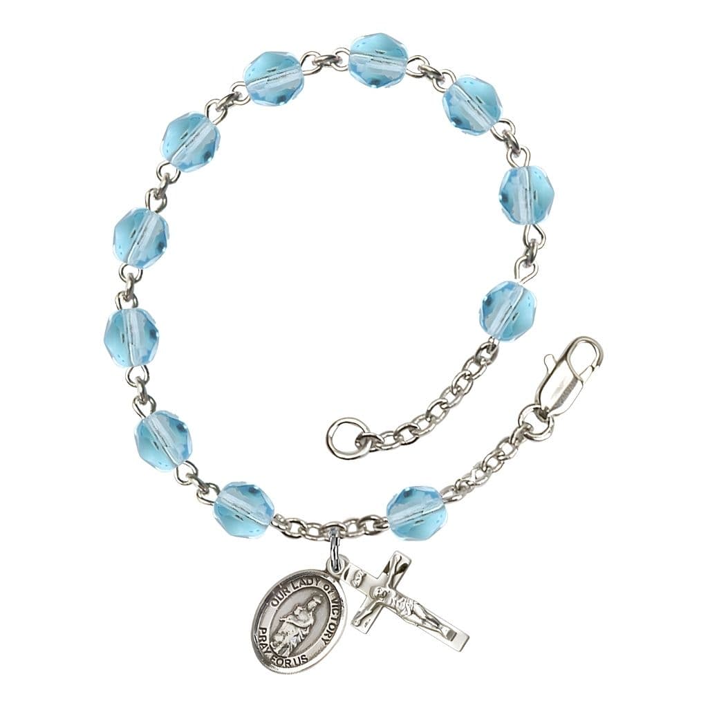 Bliss Catholic Our Lady of Victory March Birthstone Aqua  6mm Fire Polished Silver-plated Rosary Bracelet with Pewter Centerpiece and Crucifix