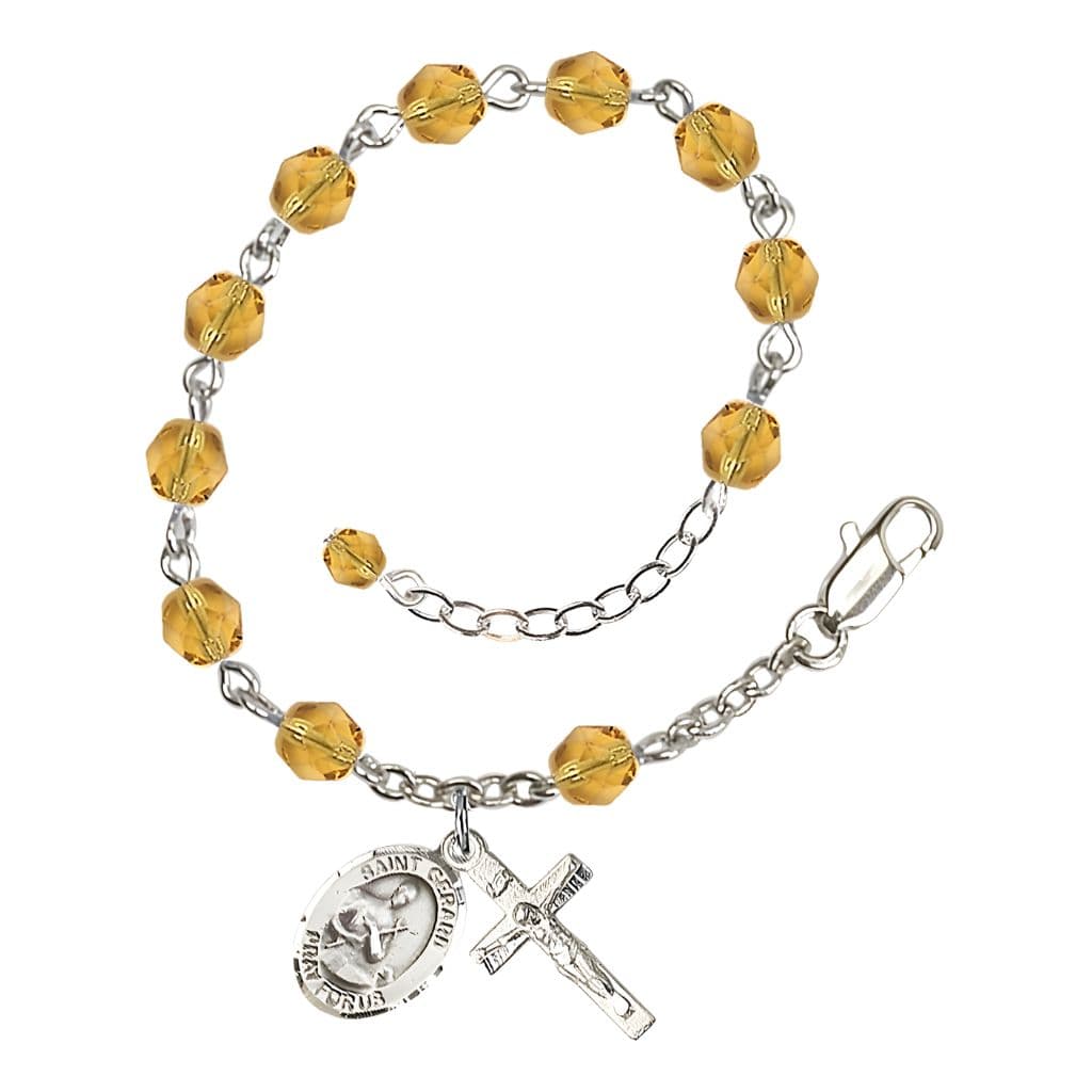 Bliss Gerard Majella Rosary Bracelet with Pewter Crucifix and Medal, Birthstone 6mm Fire Polished Topaz Beads for November