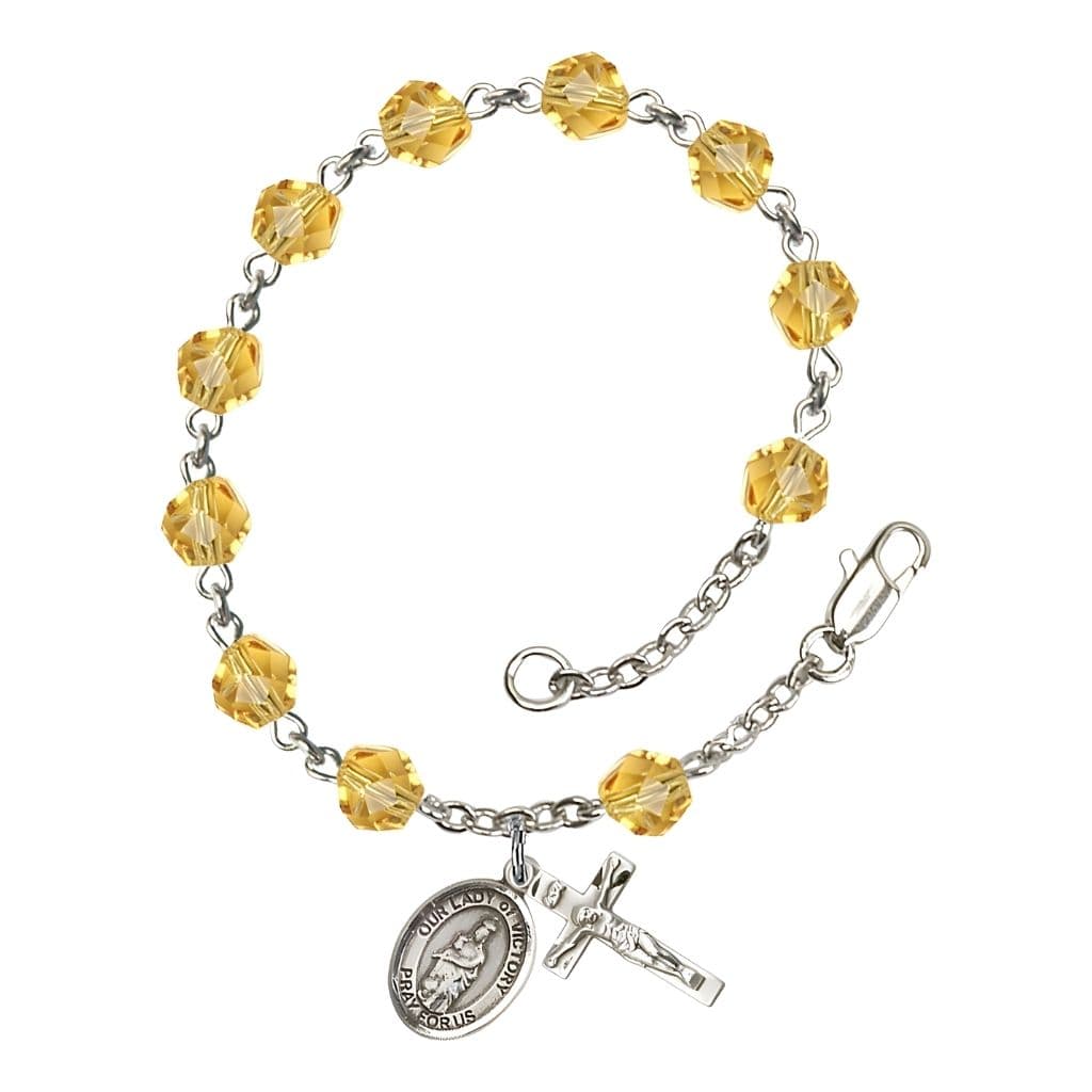 Bliss Catholic Our Lady of Victory November Birthstone Topaz  6mm Fire Polished Silver-plated Rosary Bracelet with Pewter Centerpiece and Crucifix