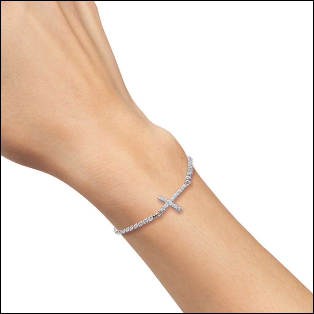 Sterling Silver Cubic Zirconia Cross Adjustable Bolo Bracelet on a person's wrist