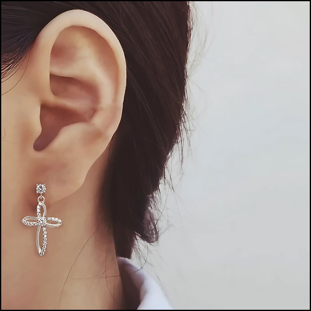 .925 Sterling Silver Cross Earrings with Polished Finish Worn on an Ear 