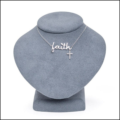 Sterling Silver Necklace with 'faith' and cross pendant on a gray stand, Singer Company