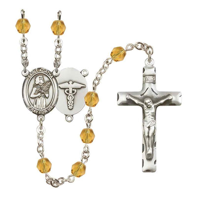 St. Agatha Nurse Medical Symbol Silver-Plated Birthstone Rosary in Topaz, Bliss Manufacturing