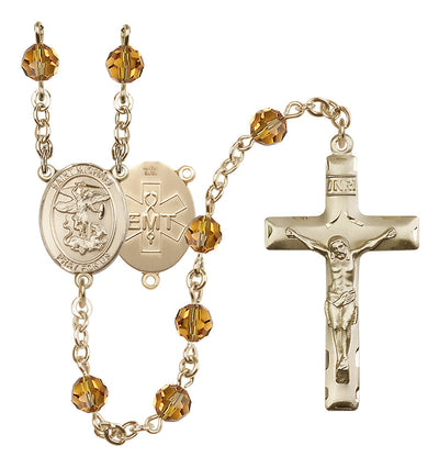 EMT 14kt Gold-filled 6mm Zircon Austrian Crystal beads with a traditional crucifix rosary and St. Michael centerpiece with EMT symbol on back in Topaz, Bliss Manufacturing