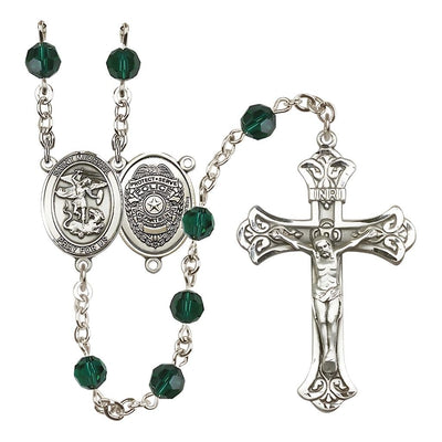 EMT Sterling Silver 6mm Ruby Austrian Crystal beads with a flared crucifix rosary and St. Michael centerpiece with Police Officer shieldl on back in Emerald, Bliss Manufacturing