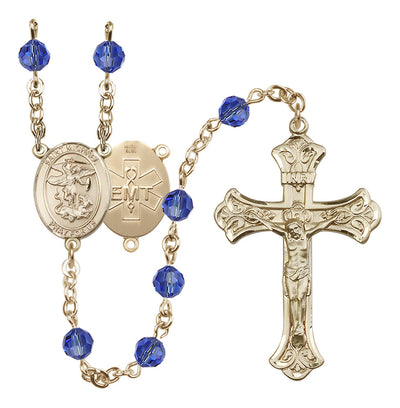 EMT 14kt Gold-filled 6mm Sapphire Austrian Crystal beads with a flared crucifix rosary and St. Michael centerpiece with EMT symbol on back, Bliss Manufacturing