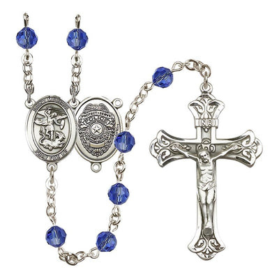 EMT Sterling Silver 6mm Sapphire Austrian Crystal beads with a flared crucifix rosary and St. Michael centerpiece with Police Officer shieldl on back, Bliss Manufacturing