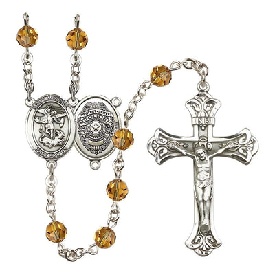 EMT Sterling Silver 6mm Topaz Austrian Crystal beads with a flared crucifix rosary and St. Michael centerpiece with Police Officer shieldl on back, Bliss Manufacturing