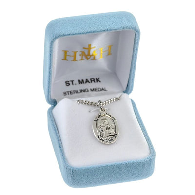 St Mark sterling silver medal with a drawing in a book and a winged lion beside him in gift box, HMH Religious