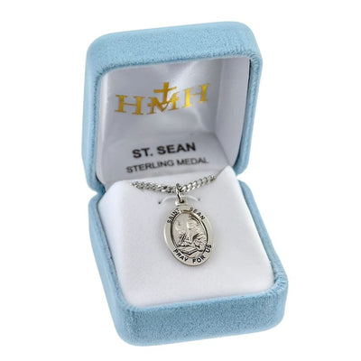 St. Sean oval sterling silver medal with an eagle and writing in a book in a gift box, HMH Religious