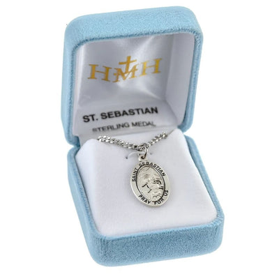 St. Sebastian oval sterling silver medal against a tree with arrows piercing his body in a gift box, HMH Religious