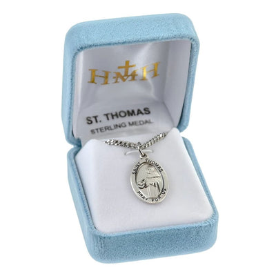 St. Thomas Aquinas oval sterling silver medal, holding a writing in a book holding a quill pen in a gift box, HMH Religious