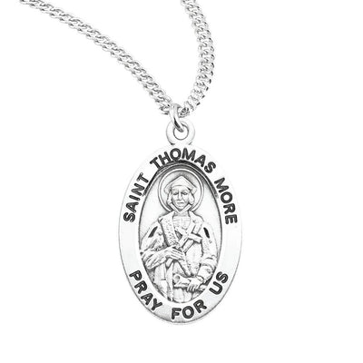 St. Thomas More oval sterling silver medal holding a cross and scroll, HMH Religious