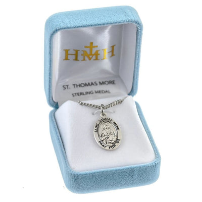 St. Thomas More oval sterling silver medal holding a cross and scroll in a gift box, HMH Religious